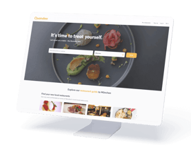 Ein Computerbildschirm, der eine Restaurantführer-Website mit Bildern von Lebensmitteln anzeigt